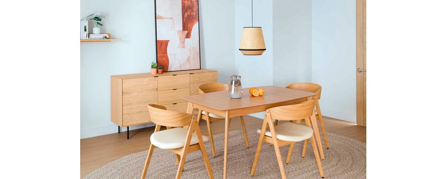 Claves para iluminar tu comedor según el color de las sillas